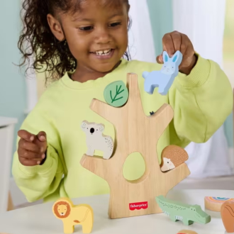 child playing with fisher-price wooden toy