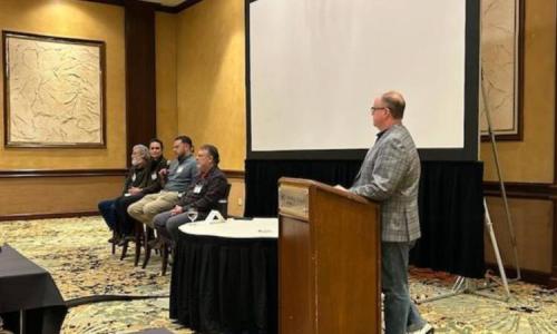 A panel of forestry professionals speaks at the Society of American Foresters Kentucky–Tennessee Winter Meeting in Knoxville, Tennessee, discussing forest management and silviculture practices.